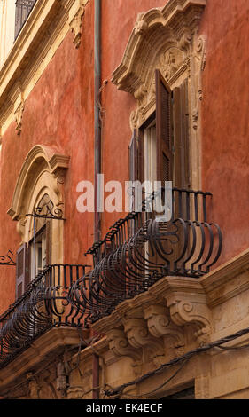 Italy, Sicily, Siracusa, Ortigia, original balcony in a baroque building facade Stock Photo