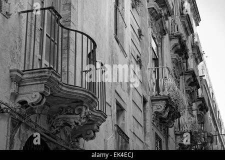 Italy, Sicily, Siracusa, Ortigia, original balcony in a baroque building facade Stock Photo