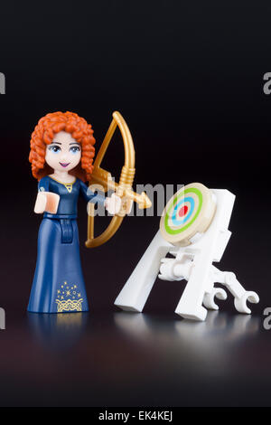 Tambov, Russian Federation -April 30, 2014 Merida minifigure with bow and target from LEGO brand Disney Princess. Stock Photo