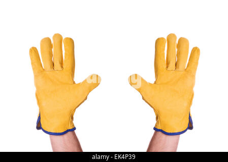 Construction Engineer Wearing Yellow Leather Protective Gloves Giving Up with Hands Raised in the Air, isolated on white Stock Photo