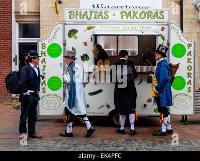 Sompting Village Morris Dancers Buying Snacks From A Mobile Food Shop, High Street, Lewes, Sussex, UK Stock Photo