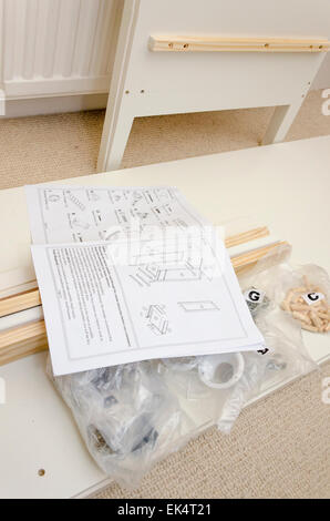 Self assembly flat pack furniture with component fixings and instruction guide Stock Photo