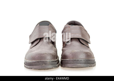 Old black safety shoe for worker isolated on white background Stock Photo