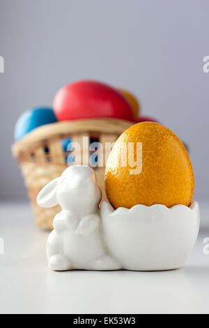 Easter egg in rabbit stand Stock Photo