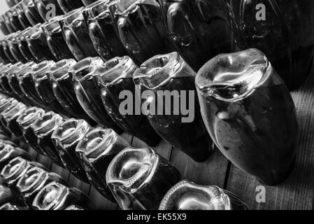 Italy, Sicily, champagne bottles aging in a wine cellar Stock Photo