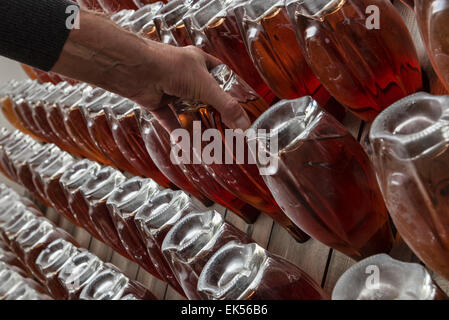 Italy, Sicily, champagne bottles aging in a wine cellar Stock Photo