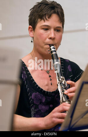 Woman playing the Clarinet in A at a charitable music concert to support aspiring musicians and composers, Farnham, Surrey, UK. Stock Photo