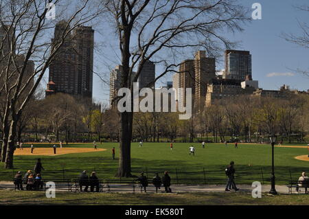 View of the Heckscher Ballfields in Central Park, New York, with tall buildings in the background Stock Photo