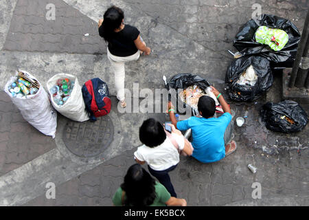 Manila, Philippines. 06th Apr, 2015. A scavengers collecting a plastic bottles from the trash bag that soon he will be sold to the nearest junk shop that can buy foods for his family in Manila. Base on the latest report of Social Weather Station (SWS) surveys results, the unemployment rate of Filipino increase about 300,000 individuals as of 2nd quarter of 2014. © Gregorio B. Dantes Jr./Pacific Press/Alamy Live News Stock Photo