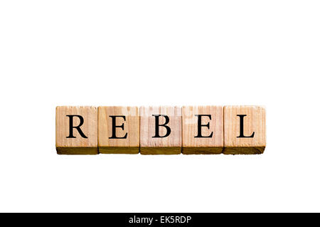 Word REBEL. Wooden small cubes with letters isolated on white background with copy space available. Concept image. Stock Photo