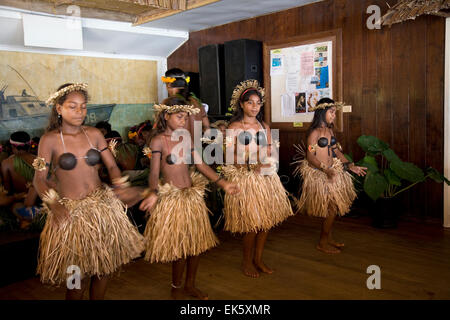 A Gilbert Island dance group performs a Tamure dance at the PT-109 Bar & Restaurant, Gizo Island. Stock Photo