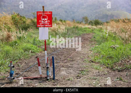 Danger!! Mines!! Warning sign at the edge of a minefiled in Pailin Province northwestern Cambodia Stock Photo