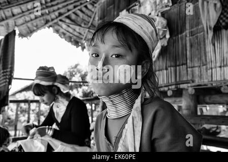 Thailand, Chang Mai, Karen Long Neck hill tribe village (Kayan Lahwi), young girl and her mother in traditional costumes. Women Stock Photo