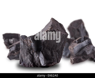 Coal lumps spilled on white background Stock Photo