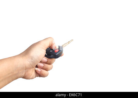 Hand holding car key isolated on white background Stock Photo