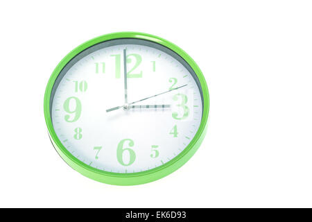 Green wall clock isolated on white background Stock Photo