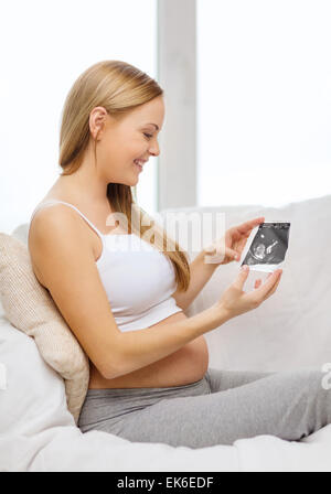 happy pregnant woman with ultrasound picture Stock Photo