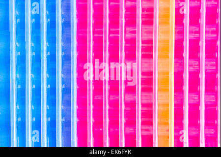Close up of stacked colorful plastic crates as a background Stock Photo