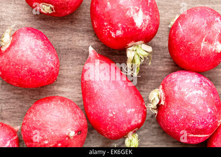 Fresh raw radishes on a wooden surface Stock Photo