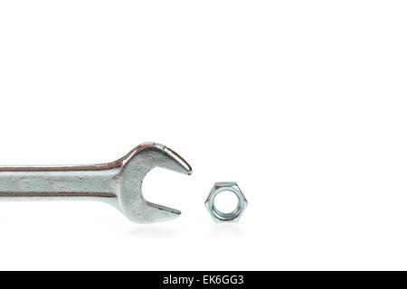 Wrench with nut isolated on white background Stock Photo