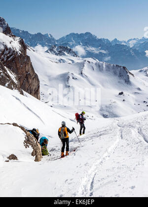 Backcountry skiers near the Rifugio Fuciade, Pale di San Martino, Dolomite Mountains, Alps, Italy Stock Photo