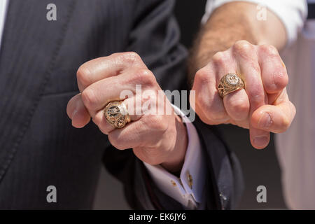 Former Texas Governor and potential Republican presidential candidate Rick Perry compares his Texas A&M class ring to a Citadel class ring during a tour of student barracks on the campus of the Citadel military college April 6, 2015 in Charleston, South Carolina. Stock Photo