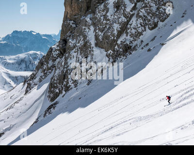 Backcountry skiers near the Rifugio Fuciade, Pale di San Martino, Dolomite Mountains, Alps, Italy Stock Photo