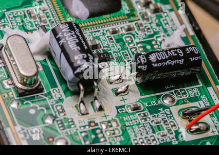 Capacitors, resistors and a crystal on a printed circuit board