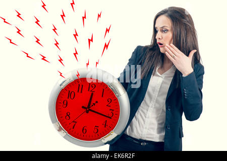 portrait of a beautiful young woman holding a big clock with red lightening bolt Stock Photo