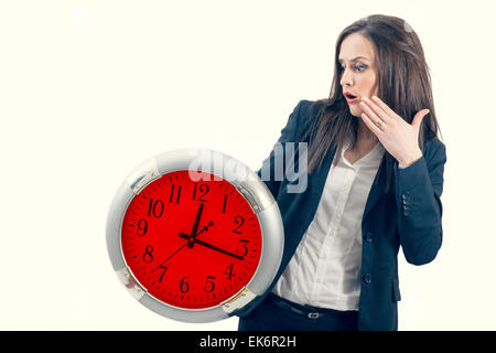 portrait of a beautiful young woman holding a big clock Stock Photo