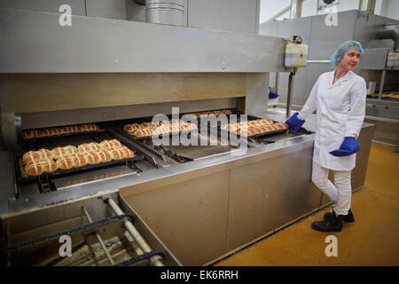 Sheldon's bakery in Openshaw producing millions of hot cross bums for Asda this Easter. Pictured freshly cooked Stock Photo