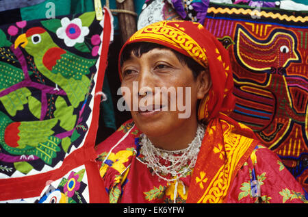 Quite colorful themsleves, Panama's Kuna Indian women are noted for their brilliant embroidered molas, San Blas Islands, Panama. Stock Photo