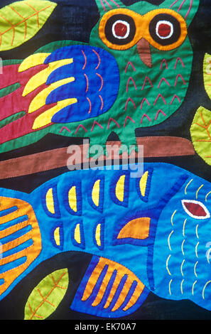 Intricate and strikingly colorful, textiles known as molas are hand-sewn by Kuna Indian women of Panama's San Blas Islands. Stock Photo