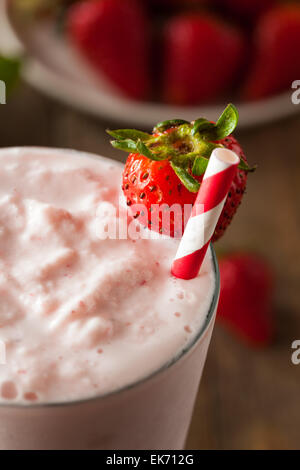 Refreshing Homemade Strawberry Milkshake in a Glass Stock Photo