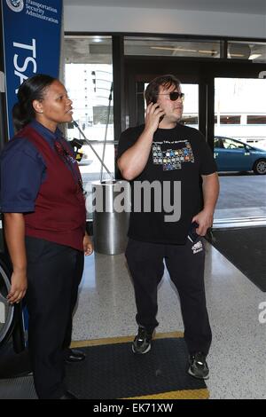 Jack Black pretends to be on phone like paris hilton as he departs LAX Featuring: Jack Black Where: Los Angeles, California, United States When: 04 Oct 2014 Stock Photo