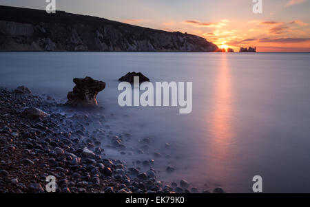A long exposure of a sunset through the Needles, seen from Alum Bay Stock Photo
