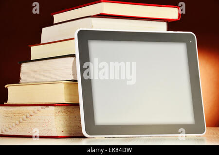 Composition with books and tablet computer on the table. Stock Photo