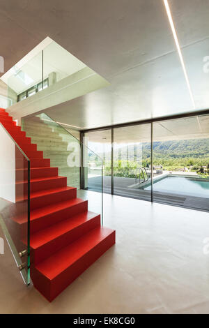 Interior, red staircase in modern villa Stock Photo - Alamy