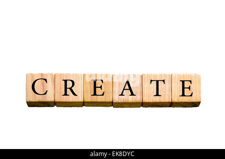 Word CREATE. Wooden small cubes with letters isolated on white background with copy space available. Concept image. Stock Photo