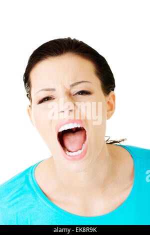 Young woman screaming with anger Stock Photo