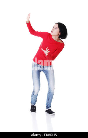 Scared woman defending herself Stock Photo