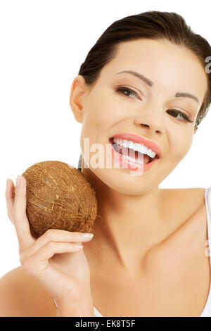 Beautiful woman with coconut in hands Stock Photo