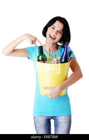 Beautiful young woman holding recycling bin Stock Photo