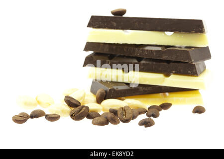 mountain of chocolate, nuts and coffee beans isolated on white Stock Photo