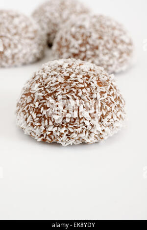 Coconut snowballs a marshmallow confection covered in chocolate and dessicated coconut Stock Photo