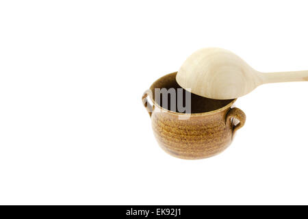 small jar with a wooden spoon isolated on white Stock Photo