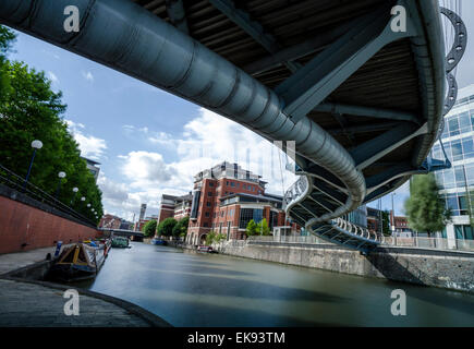 The snaky shape of Valentine's Bridge shot from below in the Temple Quay area of Bristol. Long exposure. Stock Photo