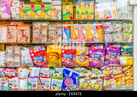 A Colorful Chinese supermarket store window front  stocked with produce Stock Photo