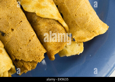 wafer rolls on a plate isolated on white Stock Photo