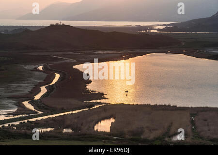 Looking across the Vrina plain wetlands at Butrint National Park, towards the Vivari channel and Butrint, Southern Albania. Stock Photo